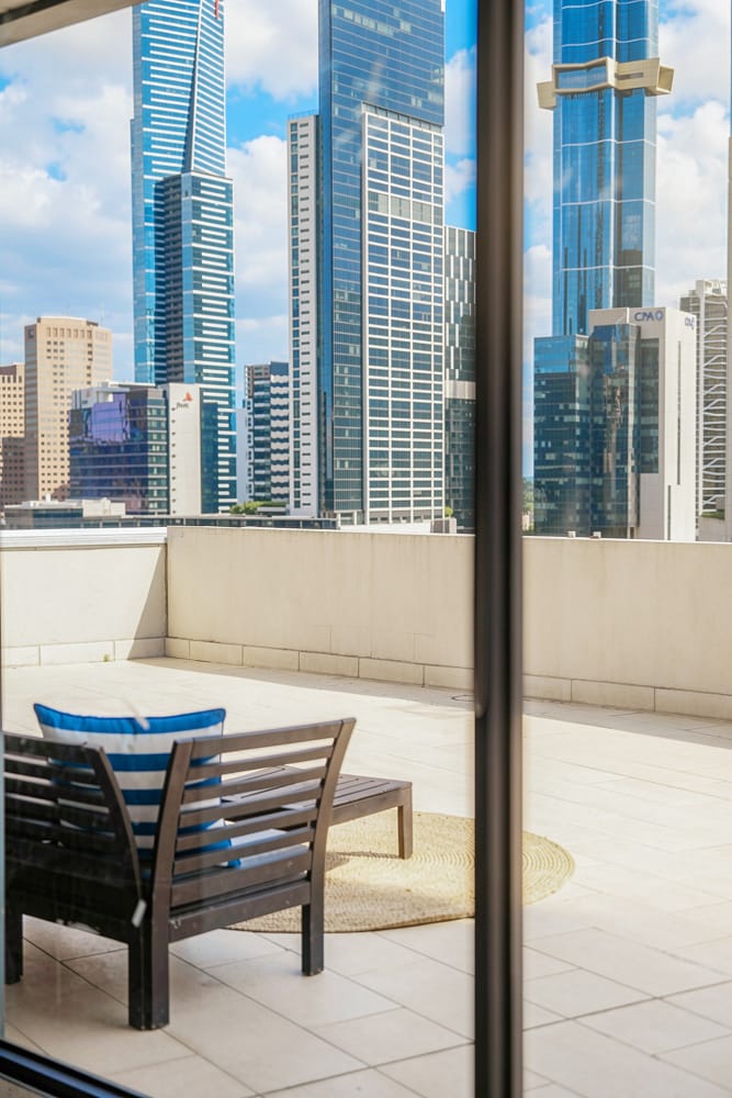 Balcony overlooking the Melbourne skyline in Kew — cinematic drone video by Melbourne Property Media